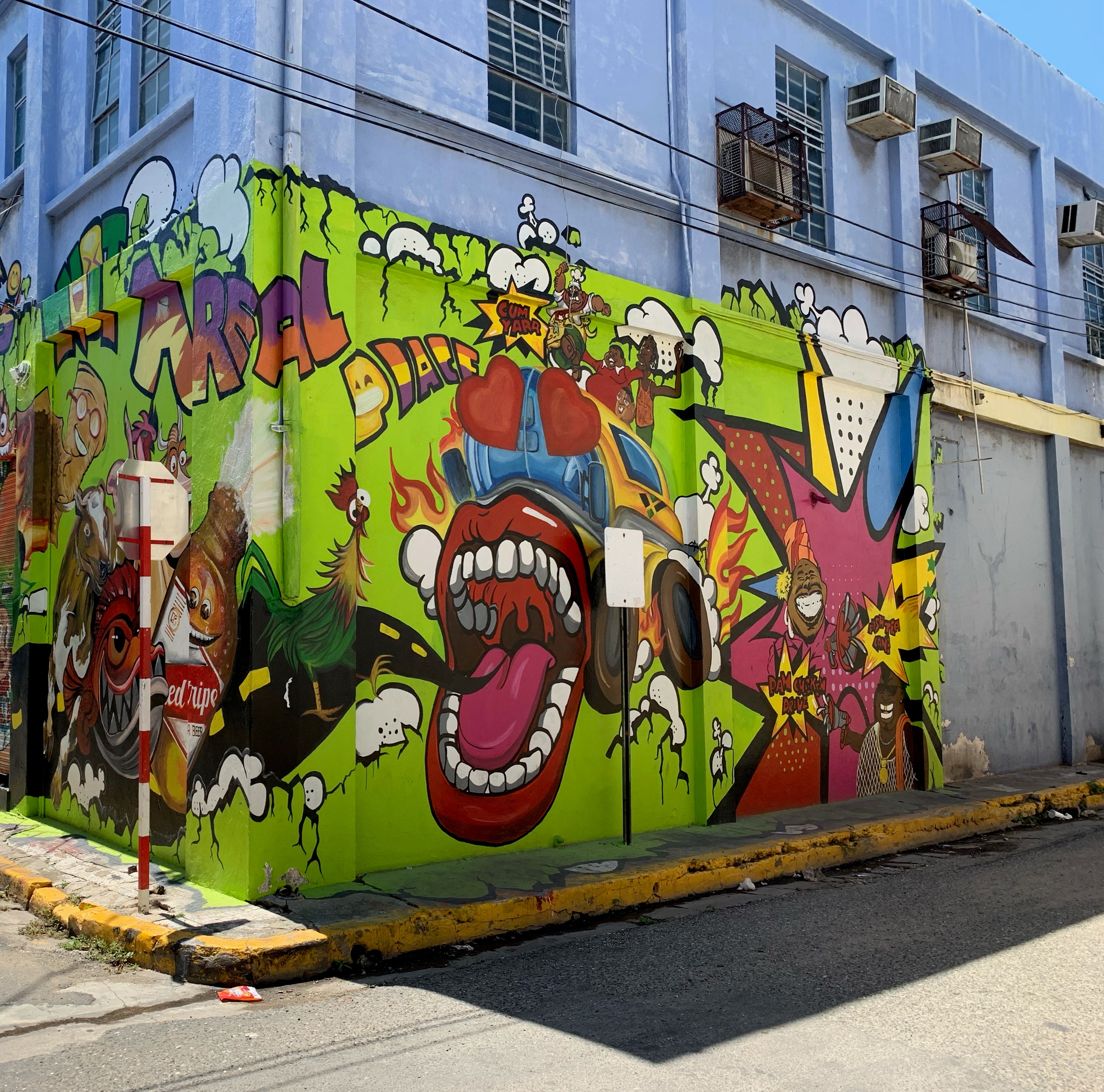 Jamaican artists paint murals to revive derelict downtown | OPENLY